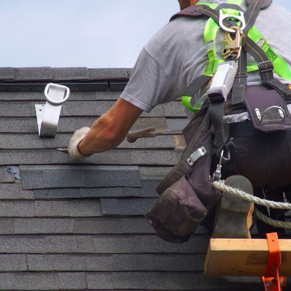 Roofer from Roofing Guys Central Coast replacing cracked and lifted shingles during a detailed roof repair on the Central Coast. Roofer from Roofing Guys Central Coast replacing cracked and lifted shingles during a detailed roof repair on the Central Coast.