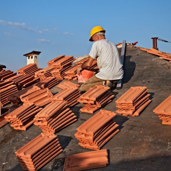 Roofing Guys Central Coast installing a new tile roof using quality terracotta tiles. We handle tile roof repairs, re-tiling, and full replacements.