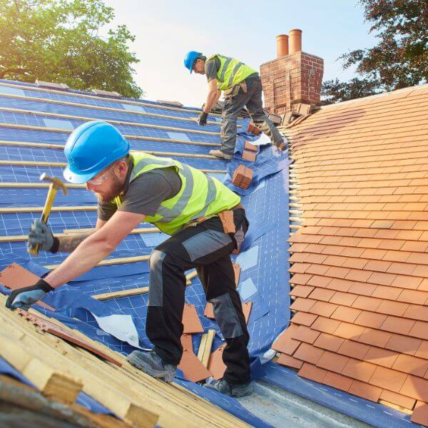 Roofing Guys Central Coast installing a new tiled roof with precision and care. We specialise in tile roof installations, re-roofing, repairs, and complete roof replacements.