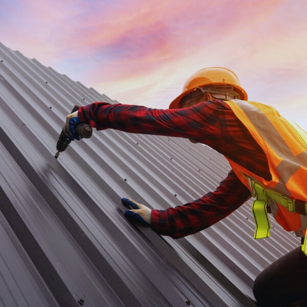 Roofing Guys Central Coast metal roofing specialist installing a Colorbond roof. We provide expert metal roof repairs, replacements, new installations, and tile-to-metal roof convers.